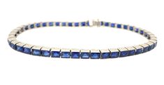 An Art Deco classic design with high quality natural blue sapphires estimated at over 9 carats total weight. Platinum bracelet; The sides are hand-engraved and the links are hand-assembled. Length: 7-1/2 inches Width: 3.65mm Height: 3.5mm Weight: 11.0 pennyweights, 17.15 grams Sapphire:Fine Blue, medium dark tone, VS clarity, 9 carat+ total weight, surface is abraded at facet junctions. Clasp: Box with click-shut tongue and hidden safety feature Condition: The clasp is tight and the links are st Formal Blue Bracelet With Polished Finish, Blue Bracelets With Polished Finish For Formal Occasions, Formal Blue Diamond Bracelet Hand Set, Blue Diamond Cut Bracelet For Formal Occasions, Formal Blue Diamond-cut Bracelet, Formal Blue Diamond Cut Bracelet, Sapphire Bracelet With Prong Setting, Platinum Bracelet, Sedona Az