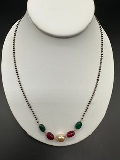 Elegant emerald, ruby, and Swarovski pearls black diamond beads chain  Handmade Jewelry  Silver-plated jewelry  One gram of gold jewelry  Official Website globusfashions.com 🌸 S H O P . M O R E . S T Y L E S  🌸 https://www.etsy.com/shop/Globusfashions Necklaces -  https://www.etsy.com/shop/Globusfashions?section_id=18712263 Bracelets - https://www.etsy.com/shop/Globusfashions?section_id=18969767 Pendant Sets - https://www.etsy.com/shop/Globusfashions?section_id=18707402 Tikka - https://www.ets Silver Pearl Necklace With Black Round Beads, Black Pearl Chain Necklace For Wedding, Celebration Pearl Chain Jewelry With Round Beads, Celebration Jewelry With Pearl Chain And Round Beads, Elegant Green Beaded Necklaces With Black Beads, Gold Pearl Necklace With Black Round Beads, Black Beaded Necklaces With Pearl Chain, Elegant Oval Beads With Beaded Chain, Celebration Necklace With Pearl Chain And Round Beads