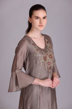 Toosh kurta with placed floral embroidery. Paired with a plain straight pant and contrasting printed black dupatta with tassels on hem. - Aza Fashions Elegant V-neck Sets For Festive Occasion, Elegant V-neck Kurta For Festive Occasions, Elegant V-neck Anarkali Set For Eid, Elegant V-neck Anarkali Set With Resham Embroidery, Elegant V-neck Festive Set, Elegant V-neck Salwar Kameez For Festive Occasions, Bollywood Silk V-neck Sets, V-neck Festival Sets With Self Design, Elegant Festive V-neck Set