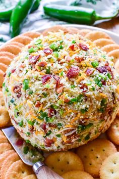 a cheese ball on a platter with crackers