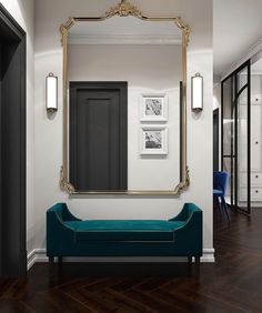 a blue bench sitting in front of a large mirror on the wall next to a doorway