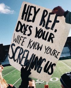 a group of people holding up a sign that says hey ret does your wife know you're screaming us