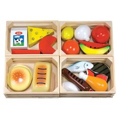 four wooden trays filled with different types of toys and food in each one's compartments