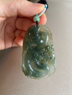 🌈 Chinese Dragon Jadeite Jade Pendant, Green & Yellowish Brown 🌷 Untreated Natural Jadeite/ Grade A Jade 🌷 Certified : YES 🌷 Jade from Burma 🌷 100% handmade carving 🌷 Dimensions : 61 x 38.8 x 8.3 mm 🌷 Color : Green & Yellowish Brown 🌷 Free standard shipping from Hong Kong with tracking included 🌷 Take approximately 7-21 days to arrive worldwide ❤️ Dragon Mythology and Symbolism Dragon is the most powerful and imperial creature in Chinese mythology, thus, the traditional and unsurpassed Traditional Green Jade Jewelry, Green Oval Carved Necklace, Jade Accessories, Handmade Green Jade Gemstones, Spiritual Jade Pendant Jewelry, Jade Jewelry Chinese, Dragon Mythology, Luxury Carved Jade Jewelry, Chinese Jade Necklace Pendants