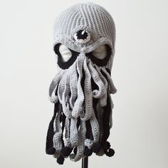 an octopus knitted hat on a mannequin head