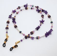 "Lovely purple tones glasses/sunglasses chain.  This unique and original chain is made using amethyst gemstone chip beads, 4mm amethyst gemstone beads, purple howlite star beads and constrasting purple glass and crystal beads.  The glasses chain measures approximately 28\" in length.   Available in gold or silver tones finish (gold pictured).   Lovely gift idea or treat for yourself." Purple Glass Glasses Chains As Gift, Adjustable Purple Glass Glasses Chains, Star Glasses, Eyeglass Jewelry, Glasses Strap, Glasses Chains, Cell Phone Charms, Sunglasses Chain, Star Beads