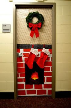 a door decorated with stockings and a wreath