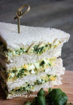 there is a sandwich with spinach and cheese on it