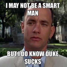 a man wearing a suit and tie with the caption i may not be a smart man but i do know duke sucks