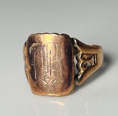 "Vintage antique rose gold signet ring with hand etched gothic initials M, R, W or L? The sides of the ring have nice scrolling \"knot\" detail and the ring is solidly constructed by hand with 3 dimensional gorgeous detail. Unmarked as was common for rings of this early time period. Ring weight is 4.2 grams and ring has a substantial and very regal feel to it. Size 10 and can be sized by our expert jeweler by adding custom sizing for 45.  Please message me at checkout to let me know your preferr Victorian Style Ceremonial Etched Engraved Ring, Victorian Signet Ring With Maker's Mark, Victorian Signet Ring With Maker's Mark As Gift, Anniversary Engraved Bronze Ring, Vintage Bronze Rings With Engraving, Antique Rings With Initials, Vintage Bronze Engraved Rings, Bronze Vintage Engraved Rings, Antique Engraved Rose Gold Rings