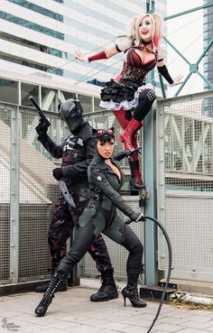 three women dressed in costumes posing for the camera