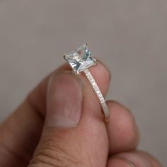 This is a gorgeous handmade creation. Its beauty is its simplicity & Elegance. The 6*6mm princess cut shape faceted aquamarine is crafted in solid sterling silver and with rhodium plated. All item is sent in a beautiful gift box You can realize more lovely stuff clicking the link https://www.etsy.com/shop/knightjewelry?refshopsection_shophome_leftnav Please leave the correct address and you phone number for delivering successfully. Square Cut Topaz Ring For Wedding, Square Cut Topaz Wedding Ring, Wedding Square Cut Topaz Ring, Fine Jewelry With Princess Cut Blue Topaz, Gift Blue Topaz Jewelry Asscher Cut, Blue Topaz Asscher Cut Jewelry For Gift, Fine Jewelry Princess Cut Topaz Anniversary Ring, Diamond Princess Cut Topaz Ring For Anniversary, Princess Cut Solitaire Topaz Ring For Anniversary