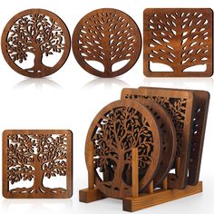 four wooden coasters with tree designs on them, and one is made out of wood