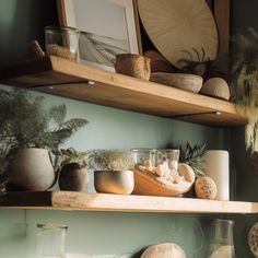 the shelves are filled with vases and other decorative items, including bowls and plates