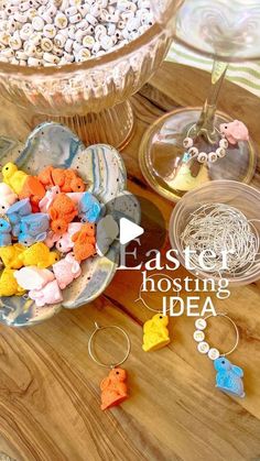 there are many small plastic animals in the bowl on the table next to each other