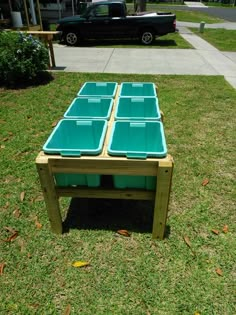 a table made out of pallets in the grass