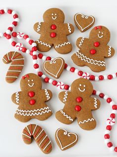 gingerbread cookies decorated with red and white beads