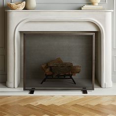 a fireplace with a fire place and some vases on the mantle