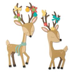 two wooden deer cut outs with flowers on their antlers