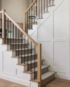 a stair case in a house with white walls