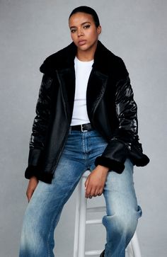 The Mel jacket blends timeless inspiration with modern design, evolving with you through different outfits, destinations, and even life stages. The contrast of soft shearling and supple leather on the front with high-gloss quilting on the back and sleeves is a distinctive spin on classic moto jackets that allows for versatile styling — from black leggings and boots to a mini dress and tights.  Water and wind resistant Genuine shearling Front asymmetrical zip closure Zipper pockets Fill: 90% Down Chic Shearling Leather Jacket For Work, Black Shearling Long Sleeve Outerwear, Chic Shearling Leather Jacket With Long Sleeves, Shearling Leather Jacket With Faux Fur Trim For Work, Chic Black Shearling Outerwear, Black Shearling Outerwear For Fall, Modern Winter Biker Jacket With Padded Collar, Luxury Long Sleeve Biker Jacket With Faux Fur Lining, Black Shearling Biker Jacket With Long Sleeves