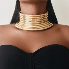 TANTA Statement Choker Our TANTA Statement Choker, makes an impact with this irresistible leather choker. Embellished with a gold motif line & adjustable, African jewellery with a glam ethnic touch. * Set included 1 Necklace & 1 Bracelet Product Details - Size: Necklace, Perimeter: 56cm - Weight : 147/185g - - Material:Acrylic and artificial leather - - Our products are all nickel free and lead free - 🚚 Free UK Delivery 🎁 Free Gift Packaging Gold Motif, African Bracelets, Leather Choker Necklace, Large Bracelet, Small Bracelets