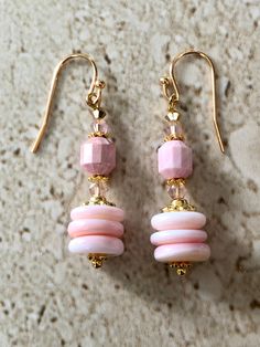 Pink Queen Conch Earrings featuring 10MM smooth oval roundelle queen conch beads accented with a rare vintage cut faceted pink queen conch beads and 4MM Silk A/B Swarovski Crystals. Gold Filled Ear Wires GIFT BOXED Pink Rondelle Jewelry, Pink Dangle Jewelry With Faceted Beads, Elegant Pink Beaded Earrings With Faceted Beads, Pink Faceted Drop Earrings, Elegant Pink Earrings With Faceted Beads, Pink Faceted Earrings For Jewelry Making, Pink Faceted Oval Beads Jewelry, Pink Oval Faceted Beads Jewelry, Conch Earrings