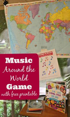 there is a map and other items on the table in front of the window with words that read music around the world game with free printable