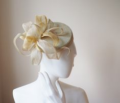 This is a light summery sinamay pillbox hat perfect for a special occasion or a day at the races. The shape of this pillbox is quite strong but it is softened by the exuberant flower trimming, giving it a very feminine look. The lighness of the sinamay makes it ec=xtrememly comfortable for wearing all day. The pillbox hat is made from scratch.  The pillbox hat is finished with hat elastic. The diameter of the hat is about 15 cm This floral sinamay pillbox hat can be made to order in the colours Sinamay Fascinator With Curved Brim For Royal Ascot, Sinamay Hat Fascinator For Royal Ascot, Summer Evening Mini Hat In Sinamay, Summer Evening Mini Hat, Summer Sinamay Fascinator With Structured Crown, Summer Fascinator With Structured Crown In Sinamay, Summer Mini Hat With Structured Crown In Sinamay, Sinamay Fascinator With Short Brim For Races, Short Brim Sinamay Fascinator For Races