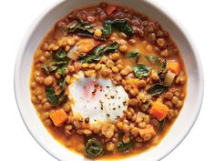 a white bowl filled with beans and spinach