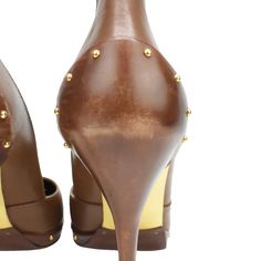 Gucci pointed-toe pumps in brown with over-exaggerated heel tabs. Features gold studs along the heel and toe sole and gold sole. Brand = Gucci Condition = 8/10, Very good, scuffing to heels and toes Size = Women's 8 US Heel Height = 110mm Material = Leather Hardware = Gold SKU = 3036-8 Formal Pointed Toe Heels With Gold Studs, Gucci Fitted High Heels, Chic Leather Heels With Gold Studs, Fitted Pointed Toe Heels With Studs, Studded Fitted Heels For Formal Occasions, Formal Studded Fitted Heels, Elegant Gold Heels With Studs, Elegant Gold Studded Heels, Formal Fitted Studded Heels