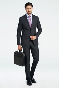 As the weather cools, keep warm in a charcoal suit brushed to an ultra-soft flannel finish. Modern Business Suits For Winter, Winter Business Suit With Custom Fit, Custom Fit Winter Business Suits, Custom Fit Business Suits For Winter, Custom Blazers, Custom Blazer, Custom Suits Men, Gray Suits, Charcoal Blazer