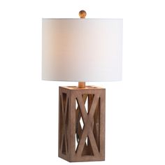 a wooden table lamp with a white shade