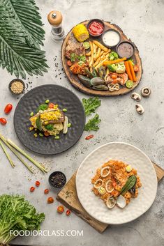 two plates filled with food on top of a table