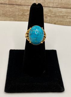 Welcome To Gold Knox Rare vintage 18K yellow gold women's ring with blue cabochon Turquoise. The stone measures 16 mm x 13 mm.Great piece with great details. Details below: Material 18k yellow gold, Turquoise Size 6 US Hallmark 18K This would make great addition to your jewelry collection. Thank you for looking PLEASE, BE SURE TO VIEW THE PICTURES CAREFULLY AND CLOSELY AS IT IS THE EXACT ITEM YOU ARE BUYING. Gold Knox Jewelry opened its storefront in Pasadena, CA in 2011, since then we do our BE Elegant Collectible Cabochon Turquoise Ring, Luxury Turquoise Oval Cabochon Ring, Gold Turquoise Ring With Oval Cabochon, Luxury Blue Oval Cabochon Turquoise Ring, Gold Turquoise Oval Cabochon Ring, Oval Turquoise Cabochon Ring In Yellow Gold, Oval Yellow Gold Turquoise Ring With Cabochon, Formal Oval Cabochon Turquoise Ring, Light Blue Gemstone