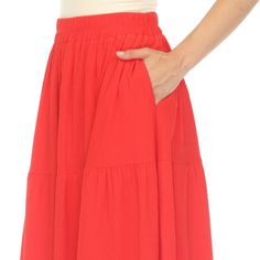 Elevate your fashion game with this flowy and effortlessly chic skirt. This maxi skirt from White Mark boasts a pleated design that adds texture, movement, and a touch of sophistication to your look. Dress it up or down as this skirt is incredibly versatile. Pair it with a tucked in blouse and heels for a sophisticated look or go for a more relaxed vibe with a tucked in tee and sandals and pair it with a jacket on chilly days. It’s perfect for various occasions and style preferences. Spring Maxi Skirt With Elastic Waistband, Chic Solid Color Gathered Maxi Skirt, Red Tiered Maxi Skirt With Elastic Waistband, Red Midi Skirt With Elastic Waistband, Solid Color Tiered Skirt With Pleated Waist, Spring Solid Color Pleated Maxi Skirt, Solid Color Flowy Midi Pleated Skirt, Solid Flowy Midi Pleated Skirt, Chic Solid Color Flowy Maxi Skirt