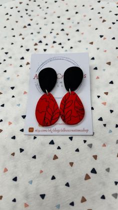 Handmade red and black pattern polymer clay statement earrings. All of my earrings are made out of polymer clay and using 925 sterling silver findings. My polymer clay earrings are handmade in United Kingdom; Please bear in mind that the earrings that you will receive may differ slightly from the image and there may be minor imperfections in each piece. That is why you are going to receive and have a modern, different and unique pair of earrings! Colours on computers monitors and screens may vary; so if you have any questions about these earrings, please send me a message prior to purchase and I will be honoured to give you the most detailed description I can. All the items will be posted in a large letter box and send via Royal Mail 1st Class; and if you order comes from UK it will be fre Hand Painted Red Polymer Clay Earrings, Red Hand Painted Polymer Clay Earrings, Trendy Red Hand Painted Earrings, Handmade Red Polymer Clay Earrings, Red Drop Earrings In Polymer Clay, Red Polymer Clay Dangle Jewelry, Everyday Red Polymer Clay Jewelry, Red Polymer Clay Drop Earrings, Elegant Red Polymer Clay Earrings