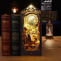 there is a clock that is on top of two books next to each other,