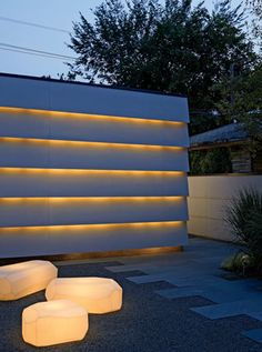 an outdoor area with lights on the wall