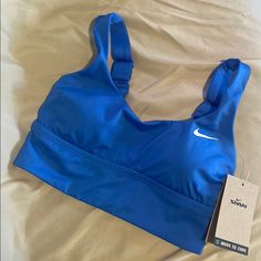 Enjoy A Day At The Beach In This Pacific Blue Bikini Top. It Features Medium Support And Has Adjustable Straps. It Is Also Fully Lined. Nike Sports Bra With Medium Bust Support, Fitted Blue Nike Swimwear, Fitted Blue Sports Bra With Built-in Bra, Blue Sports Bra For Swimming, Blue Sports Bra For Swimming With Built-in Bra, Nike Fitted Bra-friendly Top, Nike Pro Outfit, Nike Swimwear, Nike Swimsuit