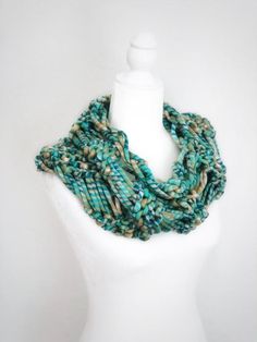 This beautiful and warm cowl is a hand knit infinity scarf. Beautiful turquoise and green colors and chunky knit make it truly one of a kind accessory. It’s made in bohemian hippie style, very warm and stylish. The cowl can be worn as a scarf and as accessory. There is no other like it.Unisex item.One size fits all.Material: bulky acrylic yarn.Care: carefully hand wash it in a warm water with mild detergent (like Woolite). Do not twist. Reshape the item and lay on a flat surface to air dry. Handmade Bohemian Infinity Scarf One Size, Bohemian Hippie Style, Hand Knitted Yarn Infinity Scarf, One Size, Bohemian White Hand-knitted Scarf, Chunky Knit Cowl, Chunky Infinity Scarves, Knitted Cowl Scarves, Scarf Chunky, Crochet Unique