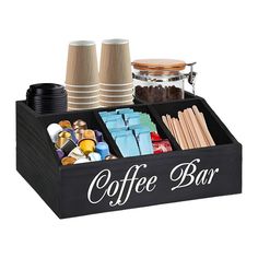 the coffee bar tray is filled with different types of drinks and confection items