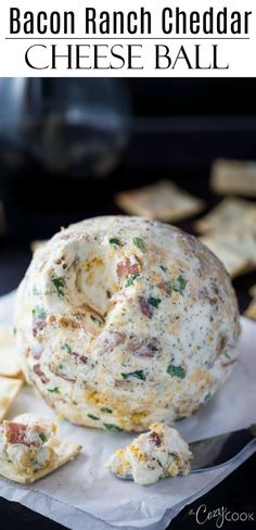 bacon ranch cheddar cheeseball on a napkin with crackers