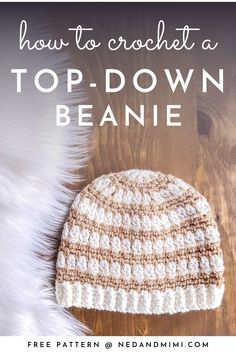 a crocheted beanie sitting on top of a wooden floor with text overlay reading how to crochet a top - down beanie