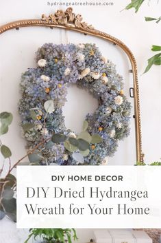 a wreath hanging on the wall with text overlay that reads diy dried hydrangea wreath for your home