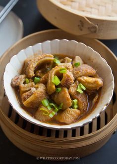 a bowl filled with food sitting on top of a table