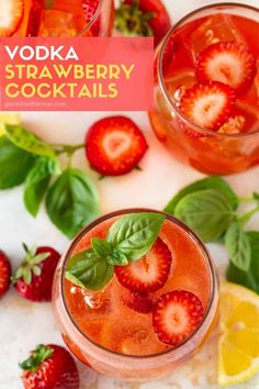 two glasses filled with strawberry lemonade and mint garnish