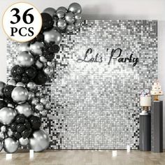 an image of a party with balloons on the wall and black and silver decorations around it