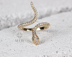 ABOUT PRODUCT This 14k Gold Snake Ring is suitable gift for girlfriend, mom and her. You can even buy as a birthday gift for your friends or anniversary gifts, If you want to add a special note we can write for you and put to inside of package. We manufacture our jewelry pieces with carefully and after production we double checking in quality control department. Our main idea is keep our items for daily wearing especially for minimalist jewelry pieces. Cute Snake animal ring. Great design tiny g Adjustable Snake Ring Fine Jewelry For Gift, Silver Cubic Zirconia Snake Ring As A Gift, Fine Jewelry Cubic Zirconia Snake Ring Gift, White Gold Snake Ring Fine Jewelry For Gift, Unique Diamond Ring With Vvs Clarity For Gift, Unique Diamond Ring With Vvs Clarity As Gift, Unique Vvs Clarity Diamond Ring Gift, Serpent Jewelry, Gold Leaf Rings