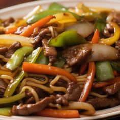 beef and vegetable stir fry on a white plate